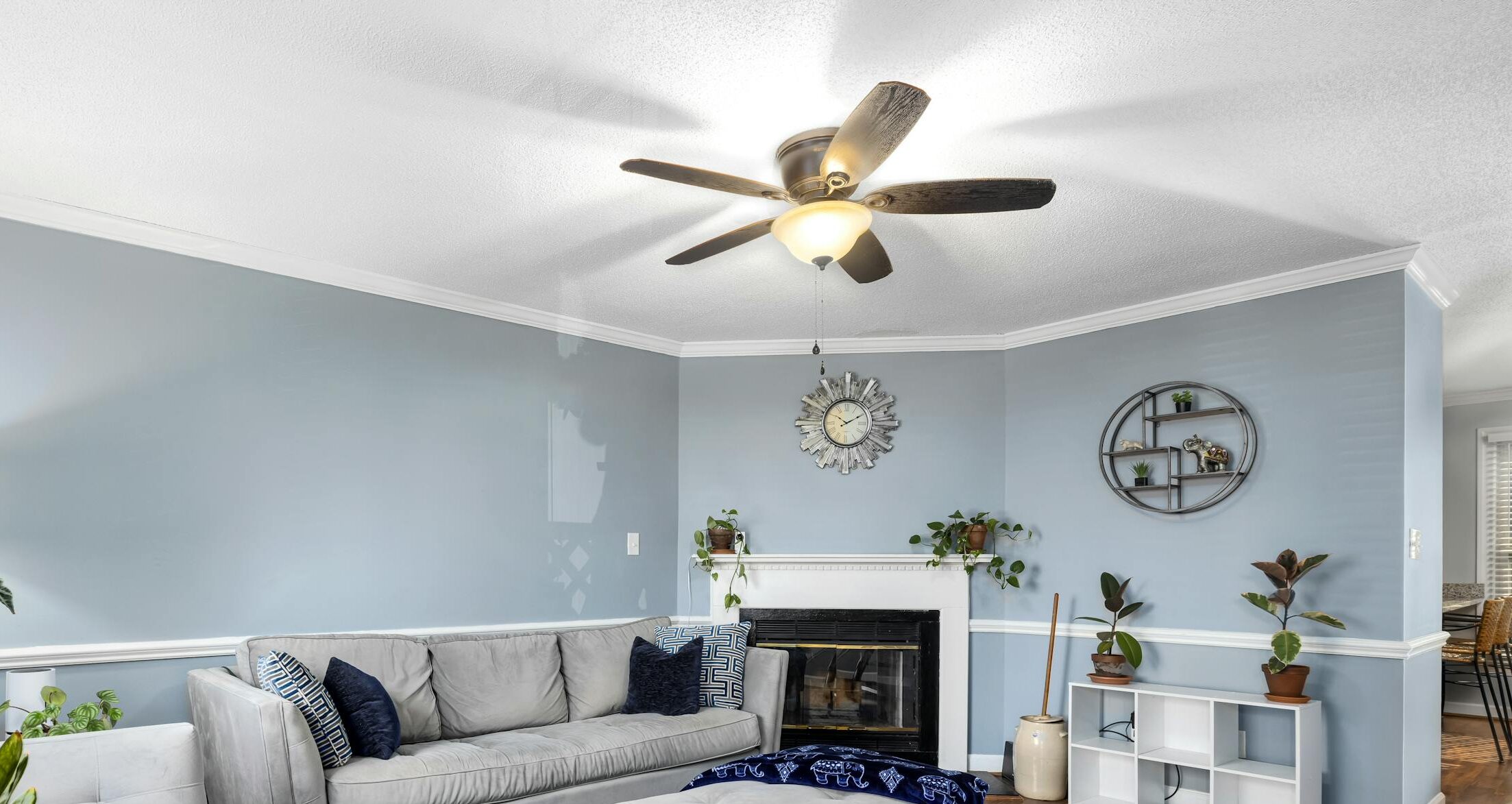 Stylish living room interior with blue decor and comfortable furniture.